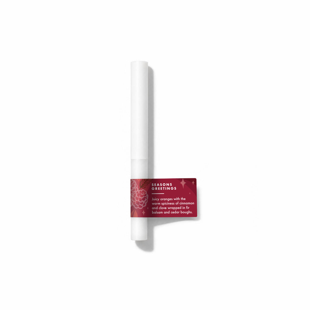 Seasons Greetings Fragrance Sample Stick - Juicy oranges with the warm spiciness of cinnmaon and clove wrapped in fir balsam and cedar boughs.